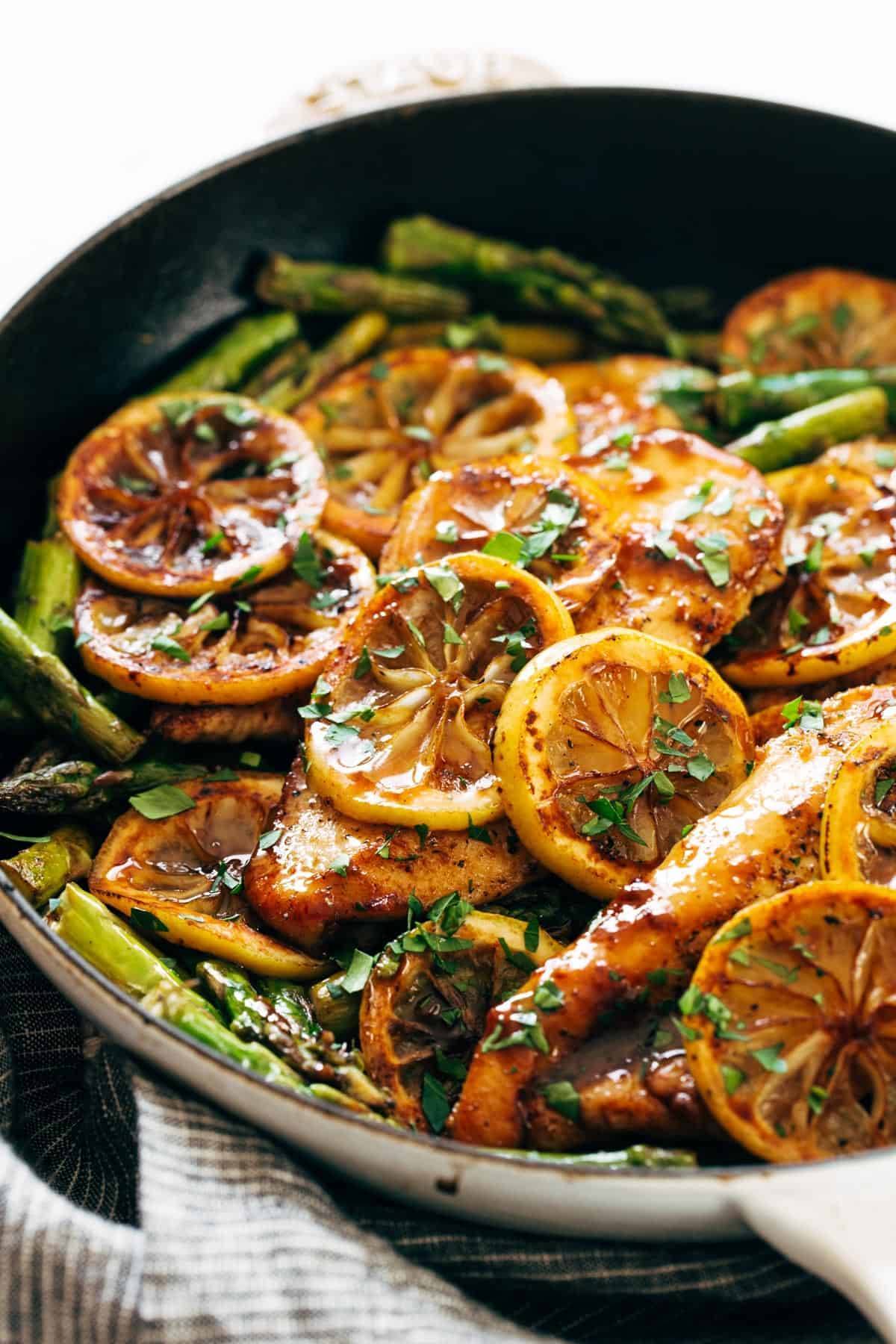 Lemon chicken with asparagus in a pan