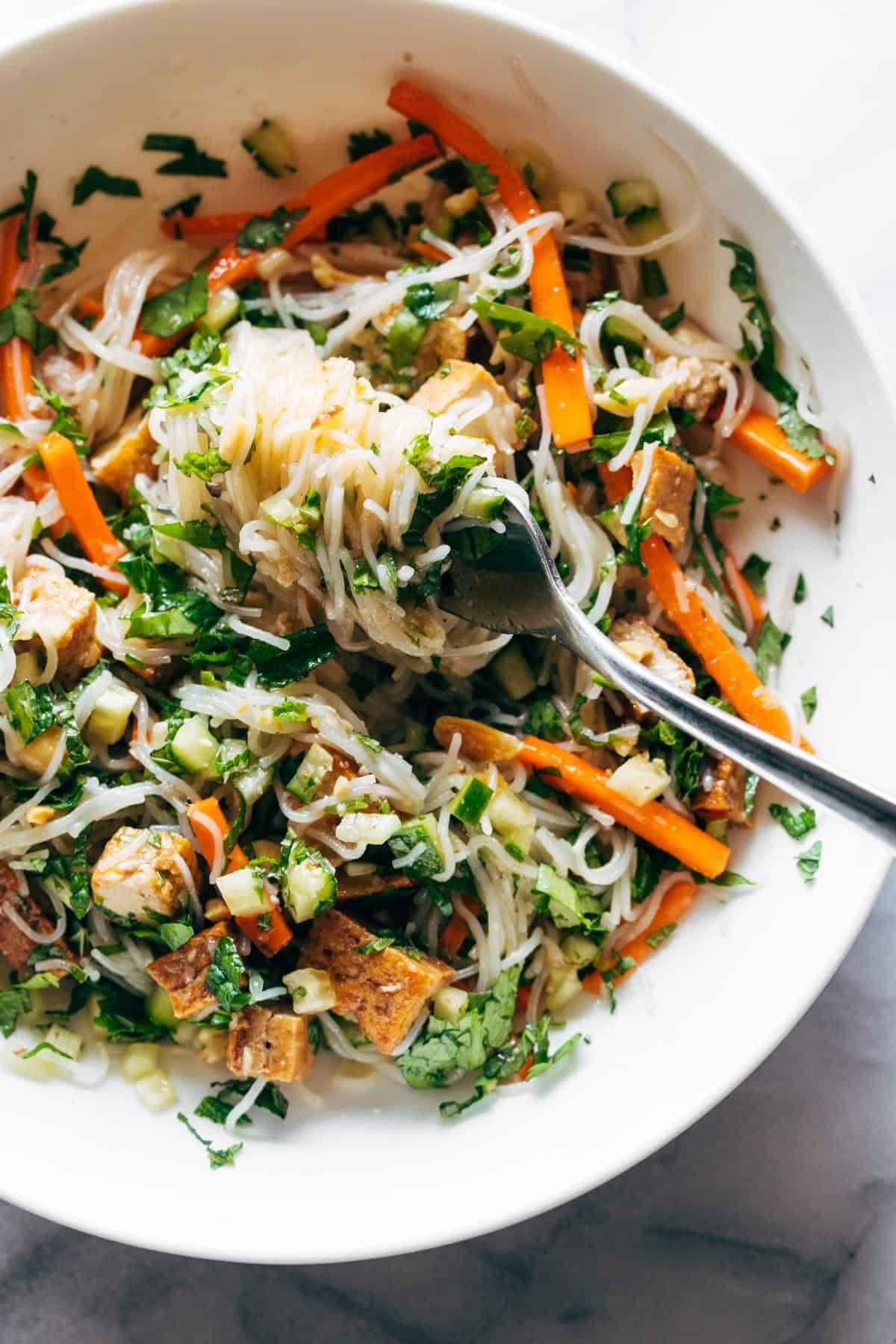 Vermicelli salad mixed up in a bowl.
