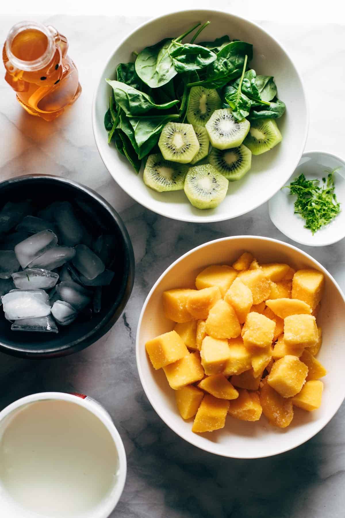 Ingredients for mango kiwi coolers in bowls.