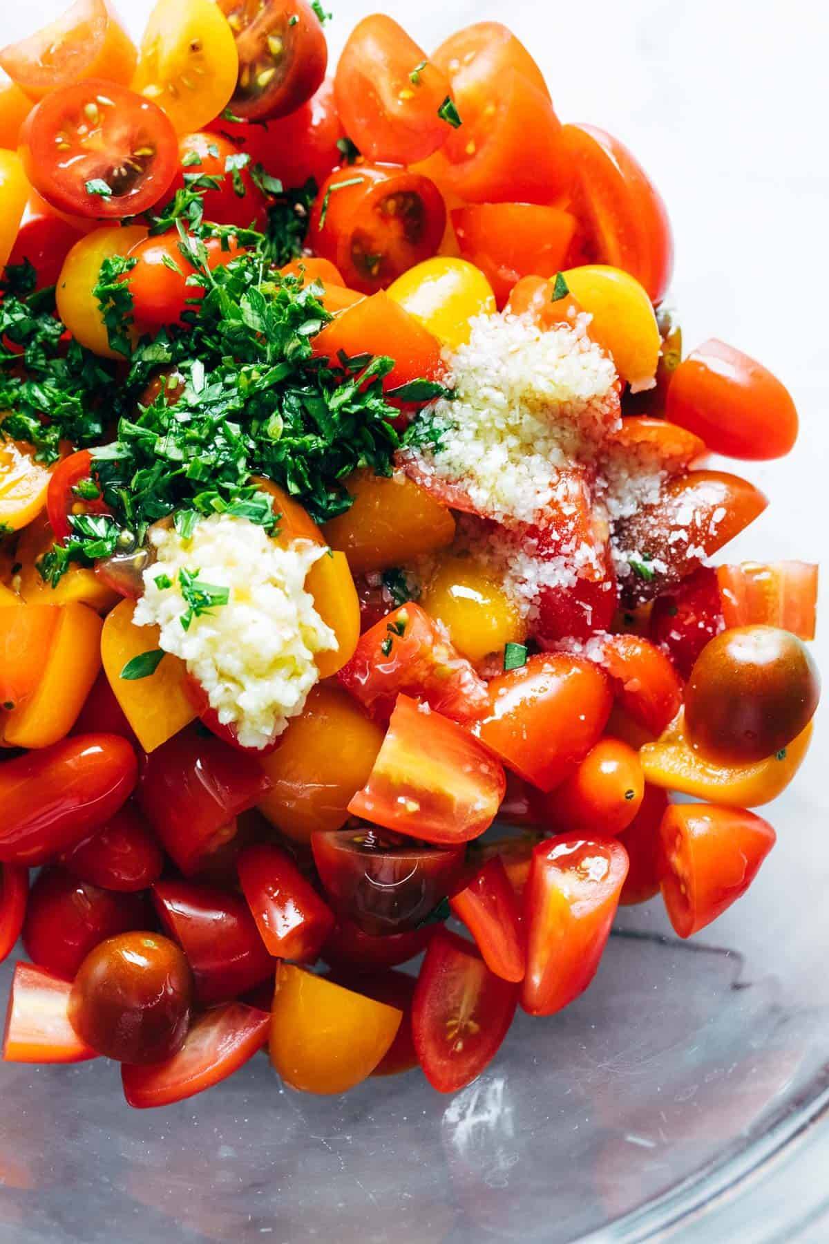 Ingredients for marinated tomatoes in a bowl.