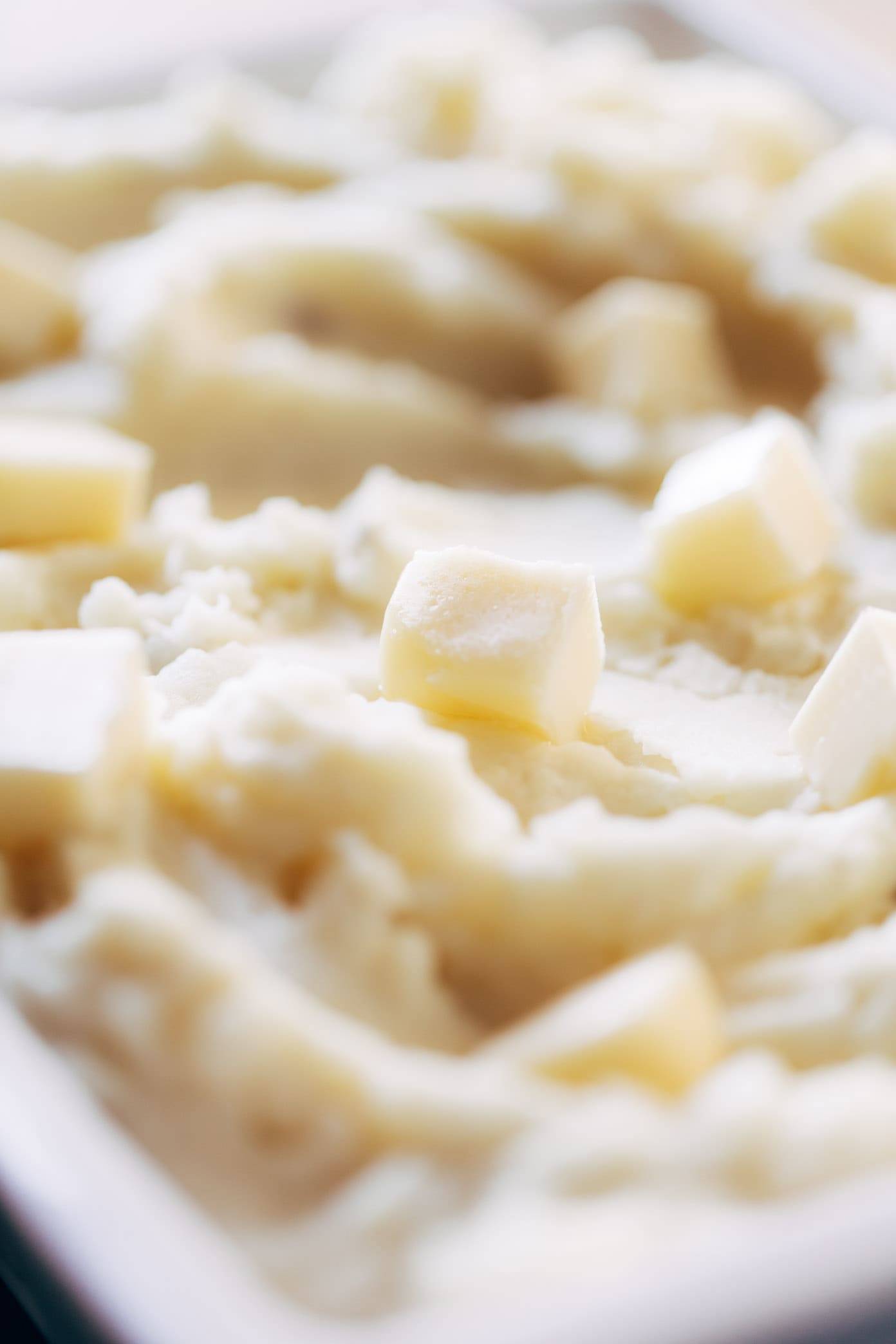 Mashed potatoes up close with butter.