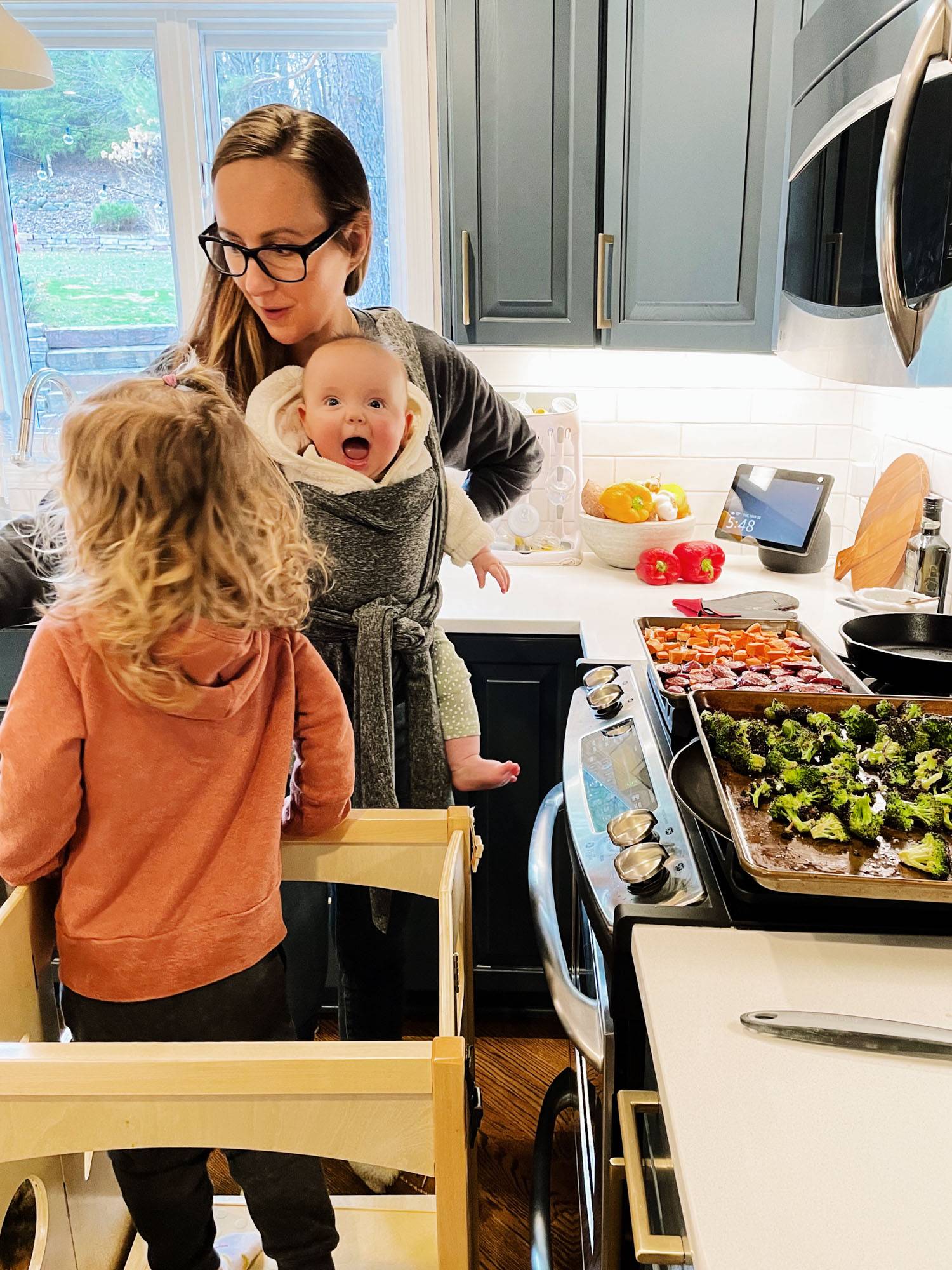 Lindsay and her daughters cooking dinner in a busy kitchen!