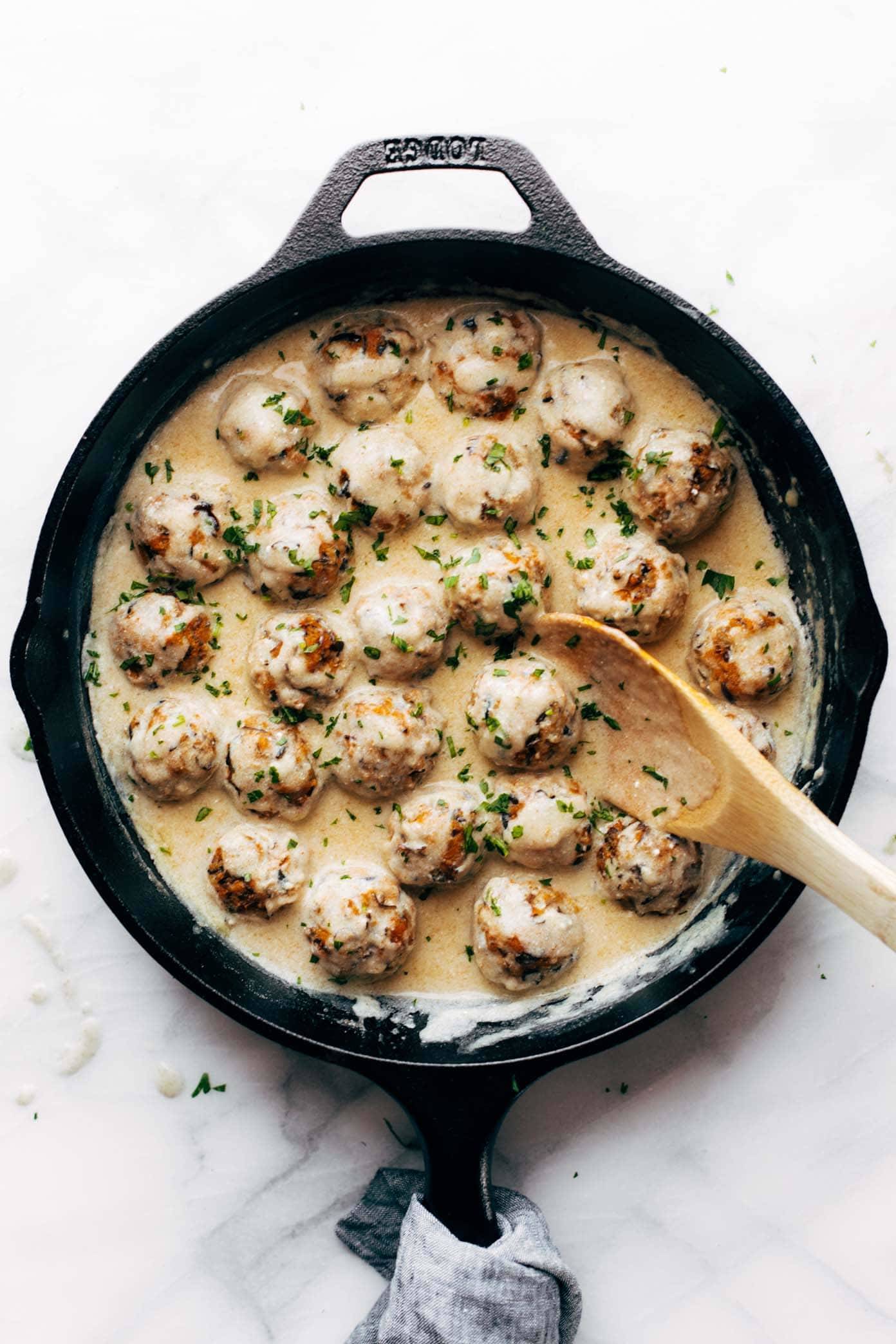 Vegetarian Swedish Meatballs in a pan with gravy.