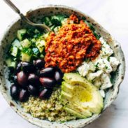 A picture of Mediterranean Quinoa Bowls with Roasted Red Pepper Sauce