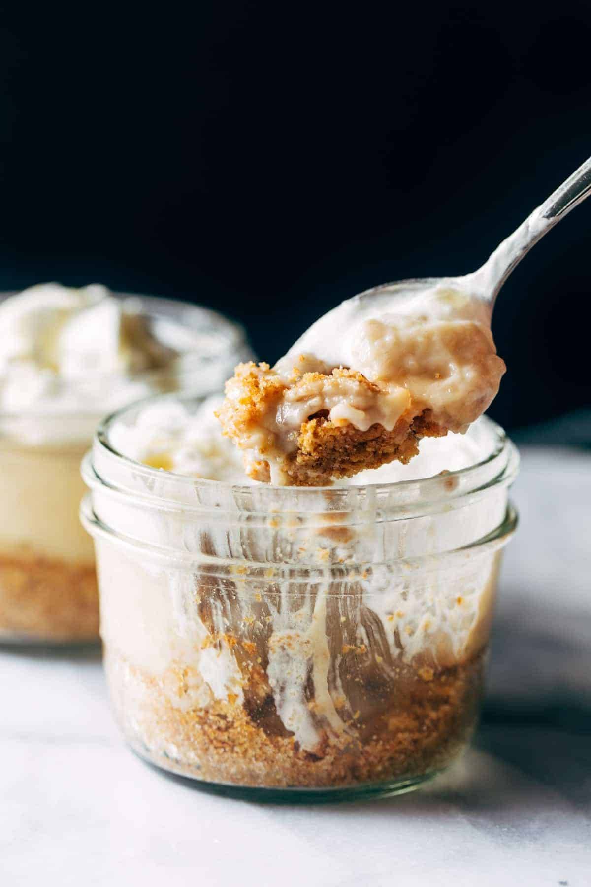 Scooping up banana cream pie in a jar.