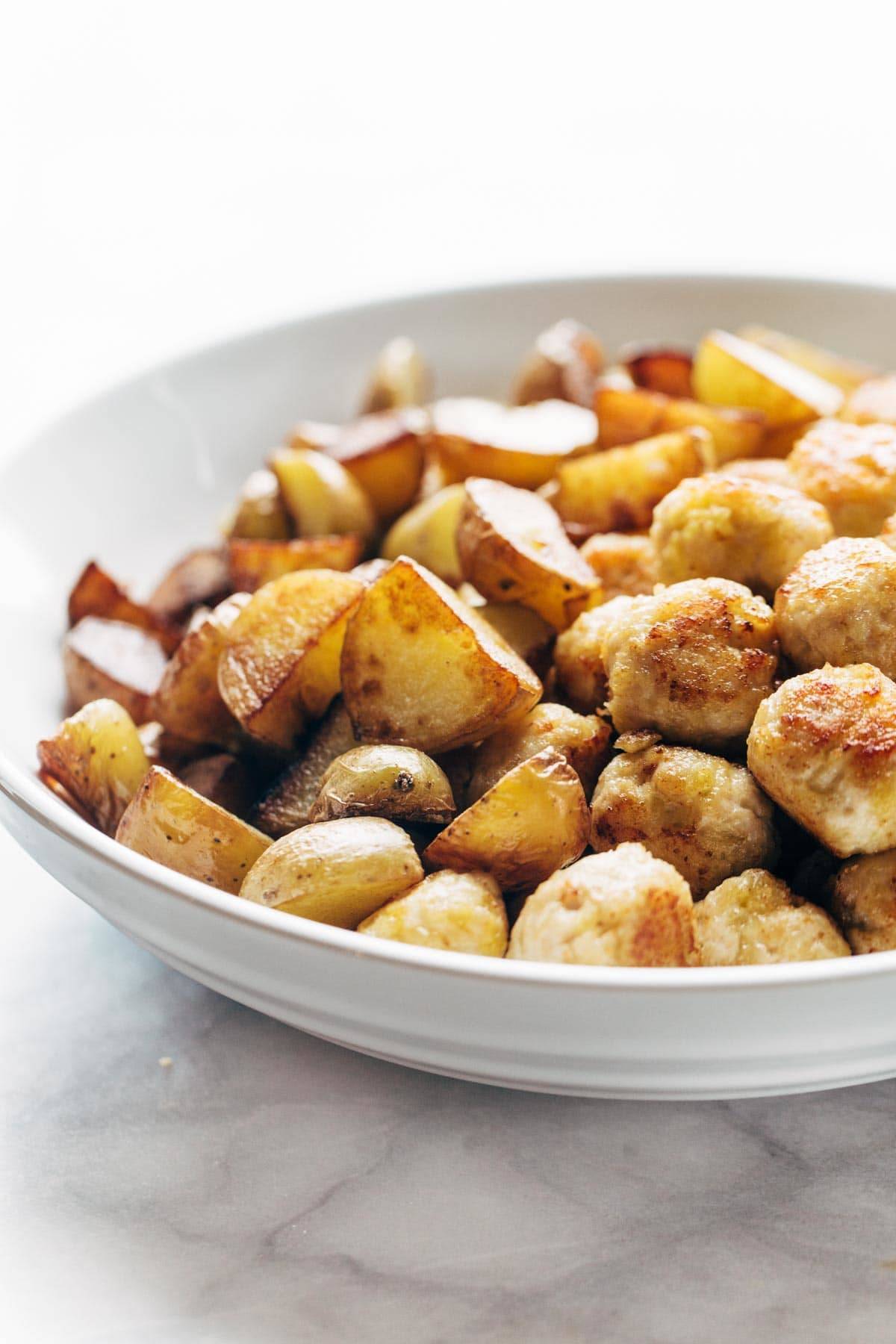 Crispy Potatoes and Mini Chicken Meatballs in a bowl.