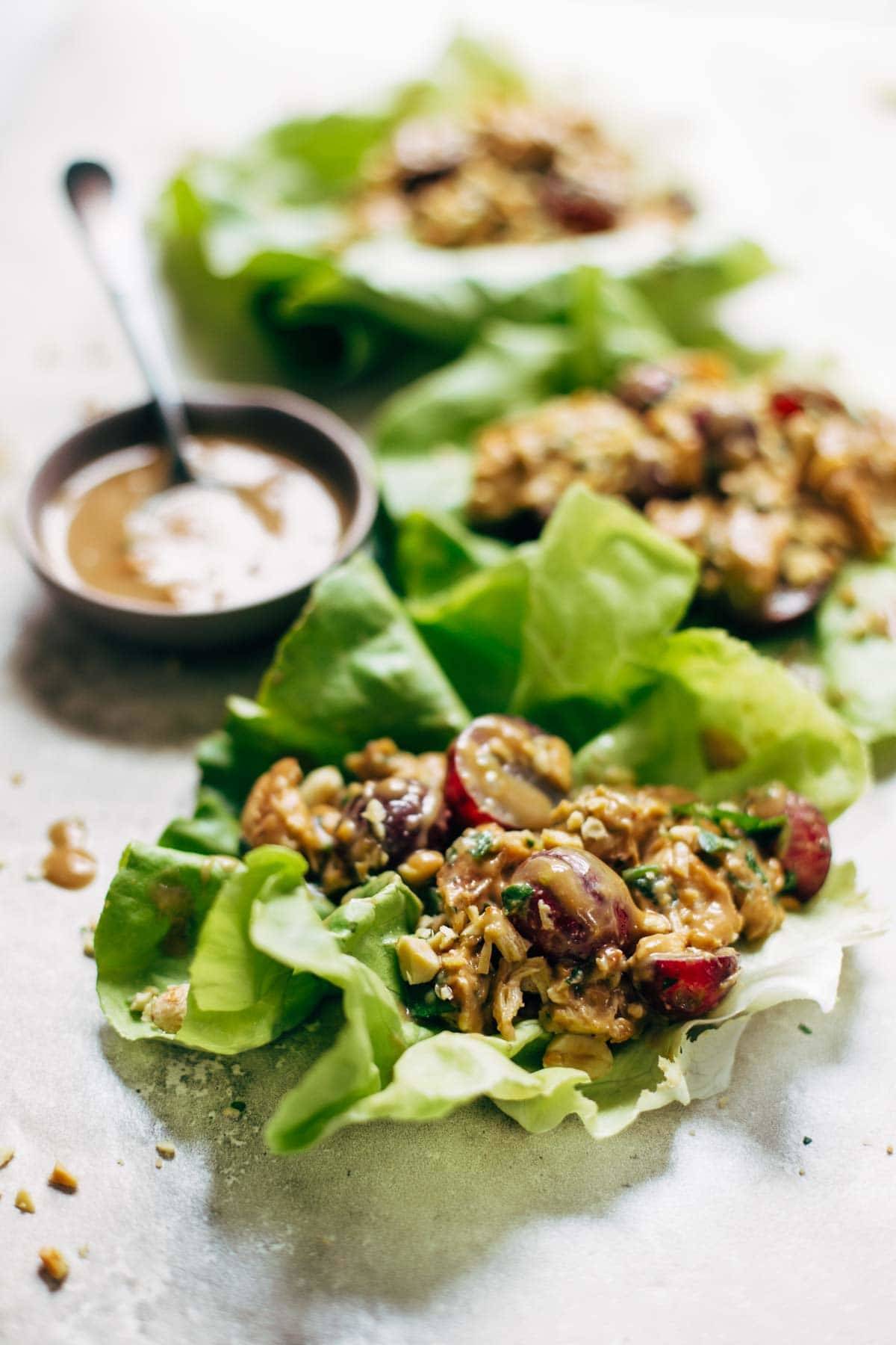 Creamy Miso Peanut Chicken Lettuce Wraps - grilled chicken and juicy grapes tossed with a simple creamy miso-peanut sauce. Super easy and healthy recipe! | pinchofyum.com