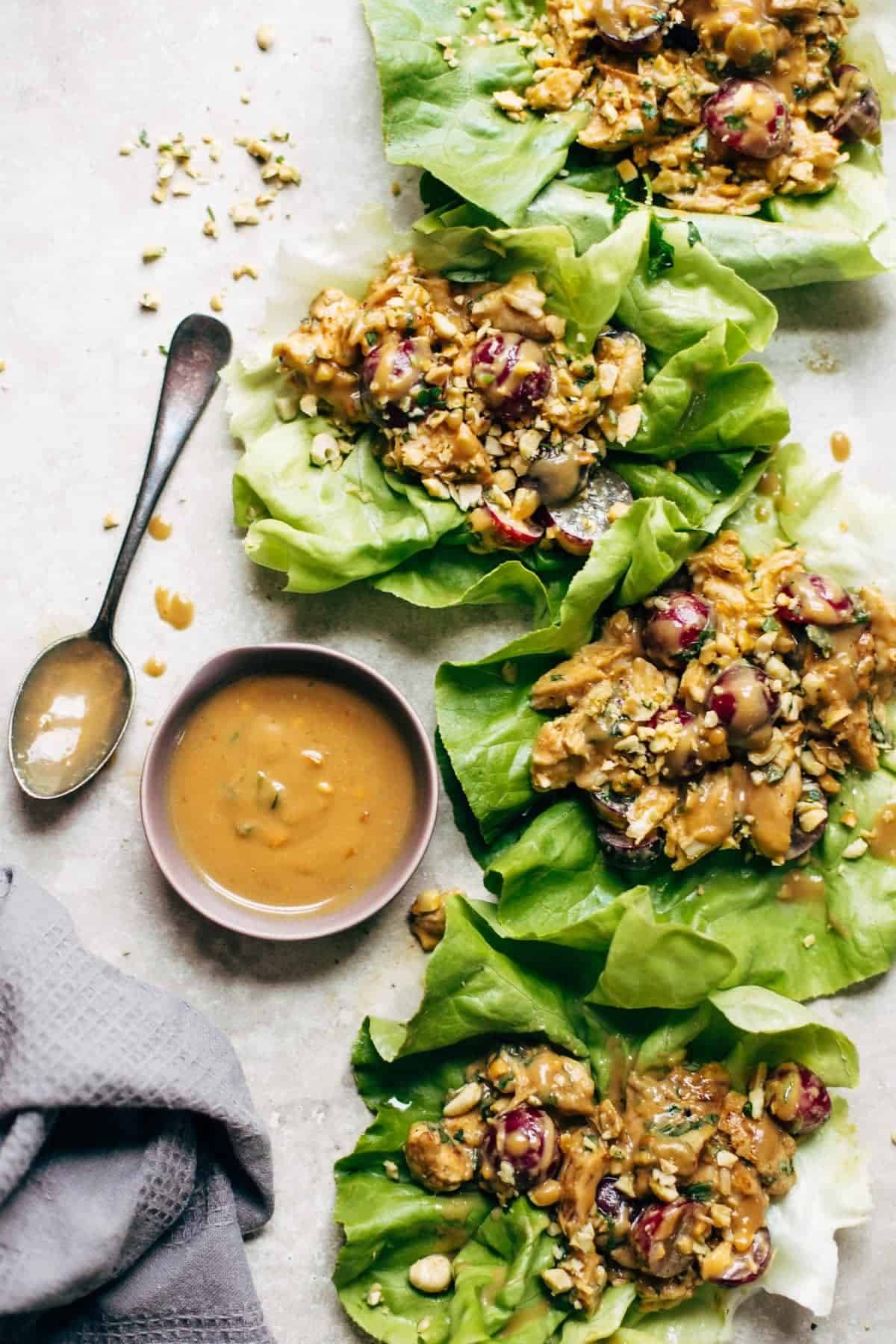 Creamy Miso Peanut Chicken Lettuce Wraps - grilled chicken and juicy grapes tossed with a simple creamy miso-peanut sauce. Super easy and healthy recipe! | pinchofyum.com