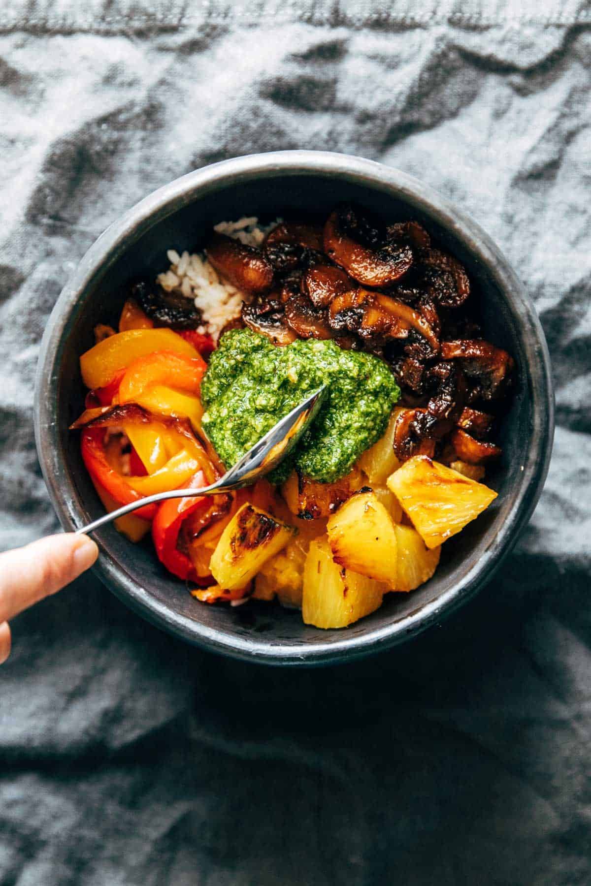 Mushroom bowls with kale pesto scooped on top.