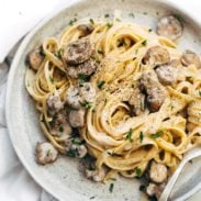 Mushroom fettuccine on plate with fork.