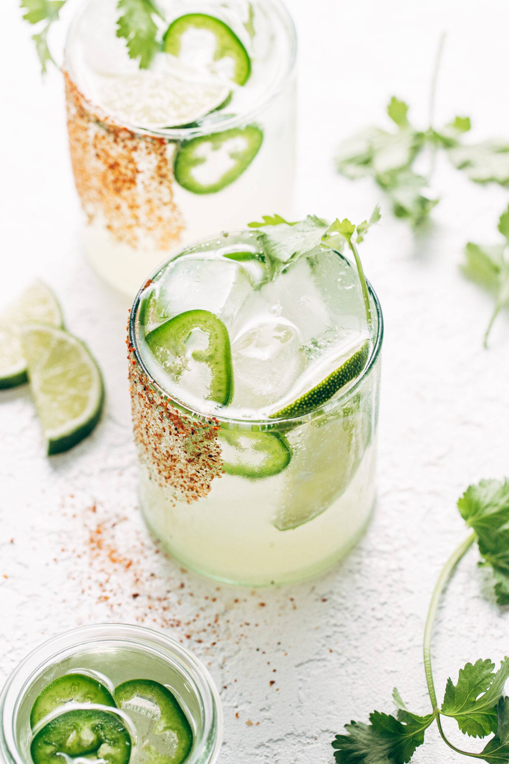 Margarita in a glass with jalapeno slices