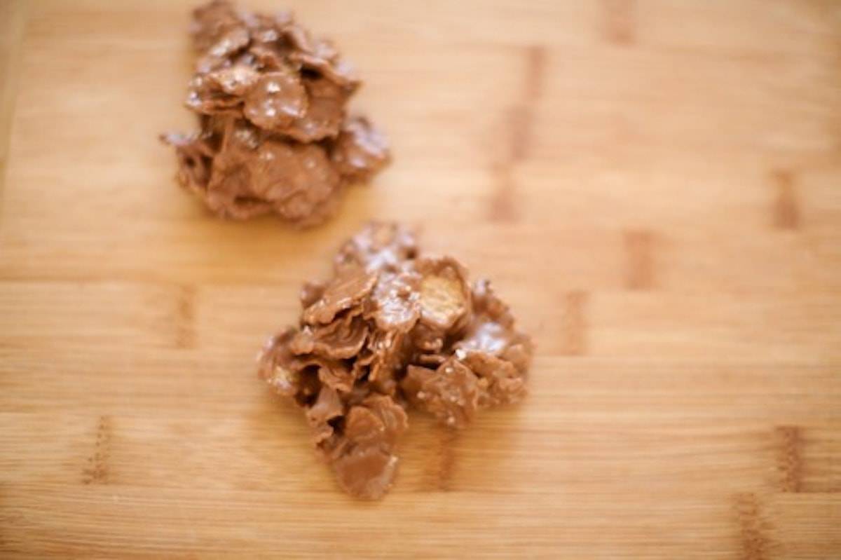 Nutella Peanut Butter Clusters on a wooden surface.