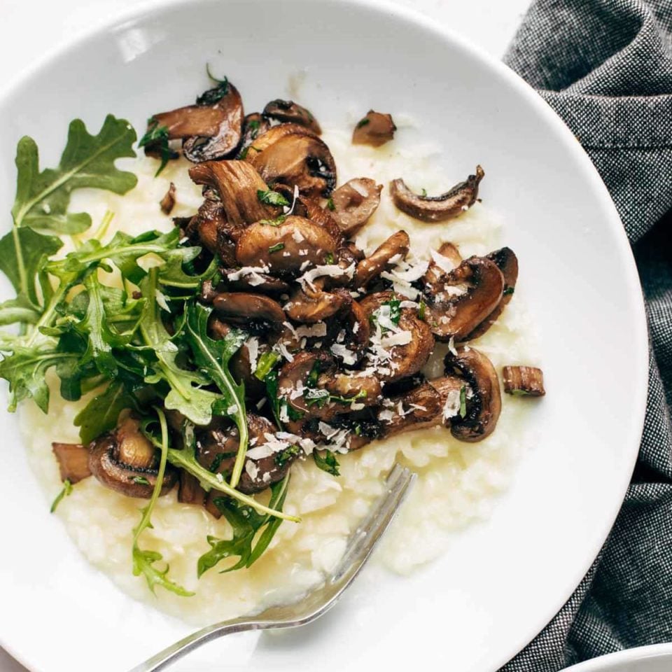 Oven risotto in a bowl with mushrooms.