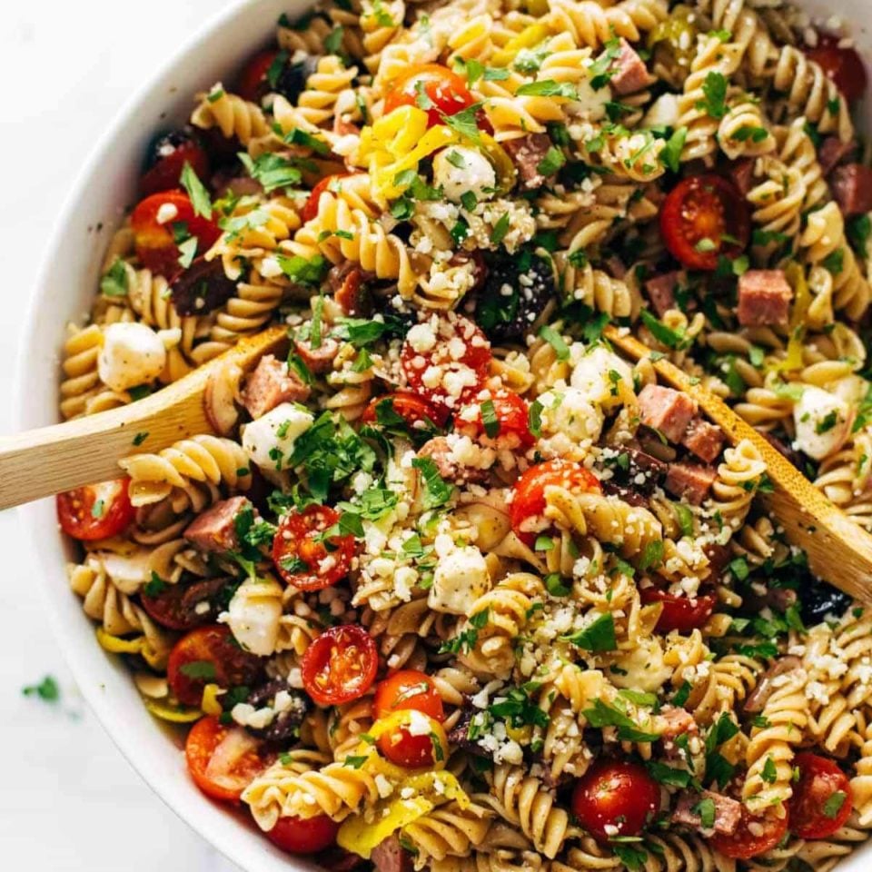 Pasta and colorful veggies mixed together in a bowl.