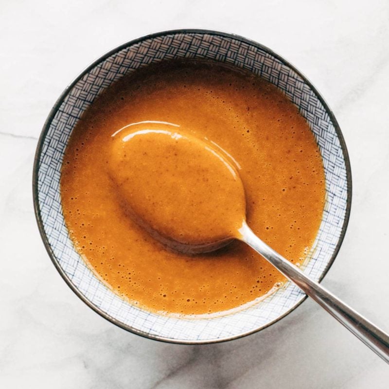 Peanut sauce in a bowl with spoon.