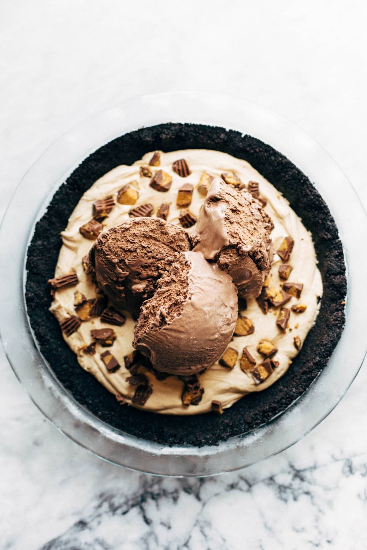 Chocolate ice cream scoops on peanut butter pie base.
