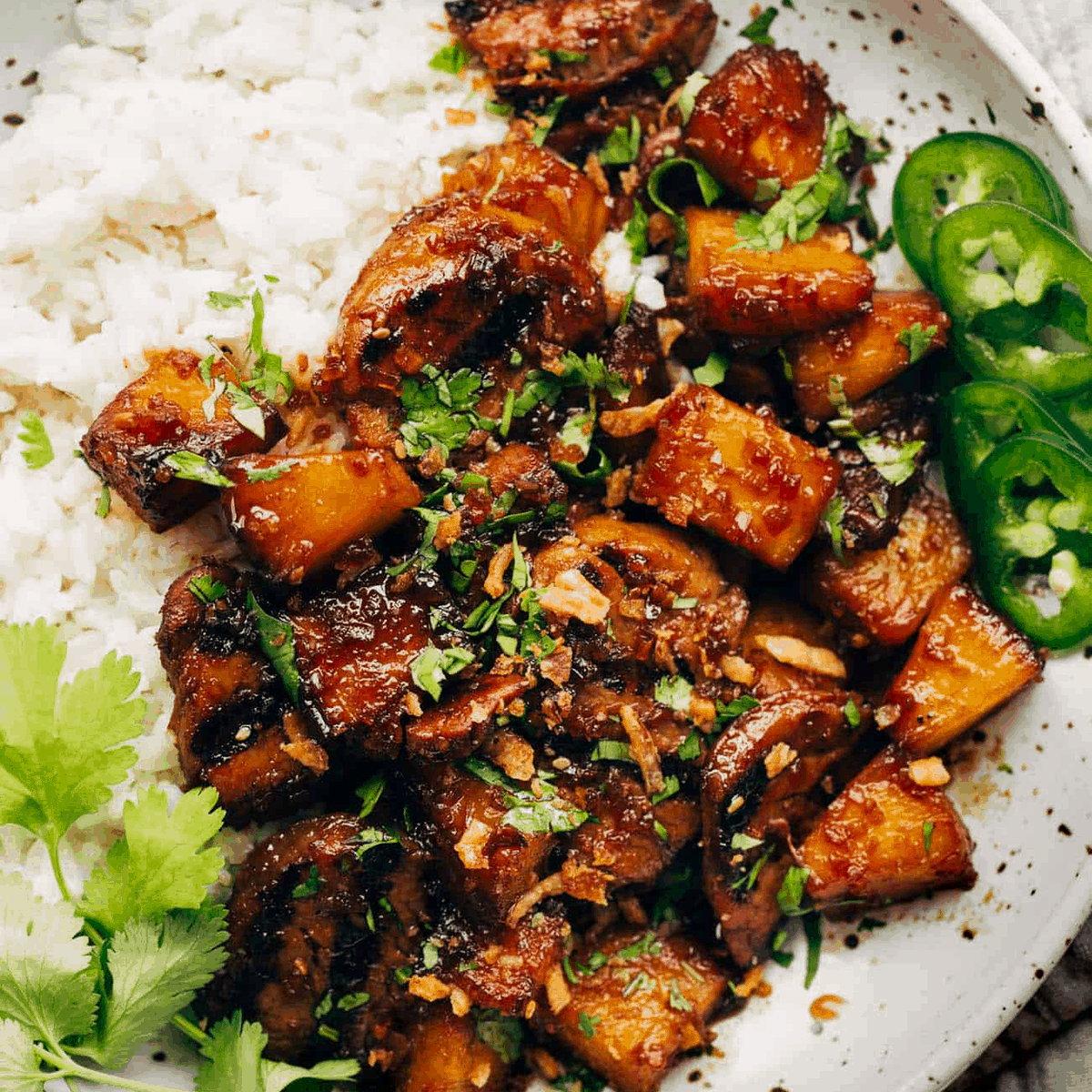 Pineapple Pork with Coconut Rice on a plate.