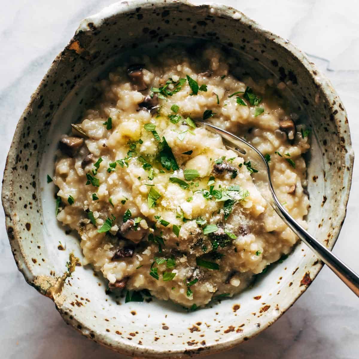 Instant Pot Mushroom Risotto in a bowl with a spoon.