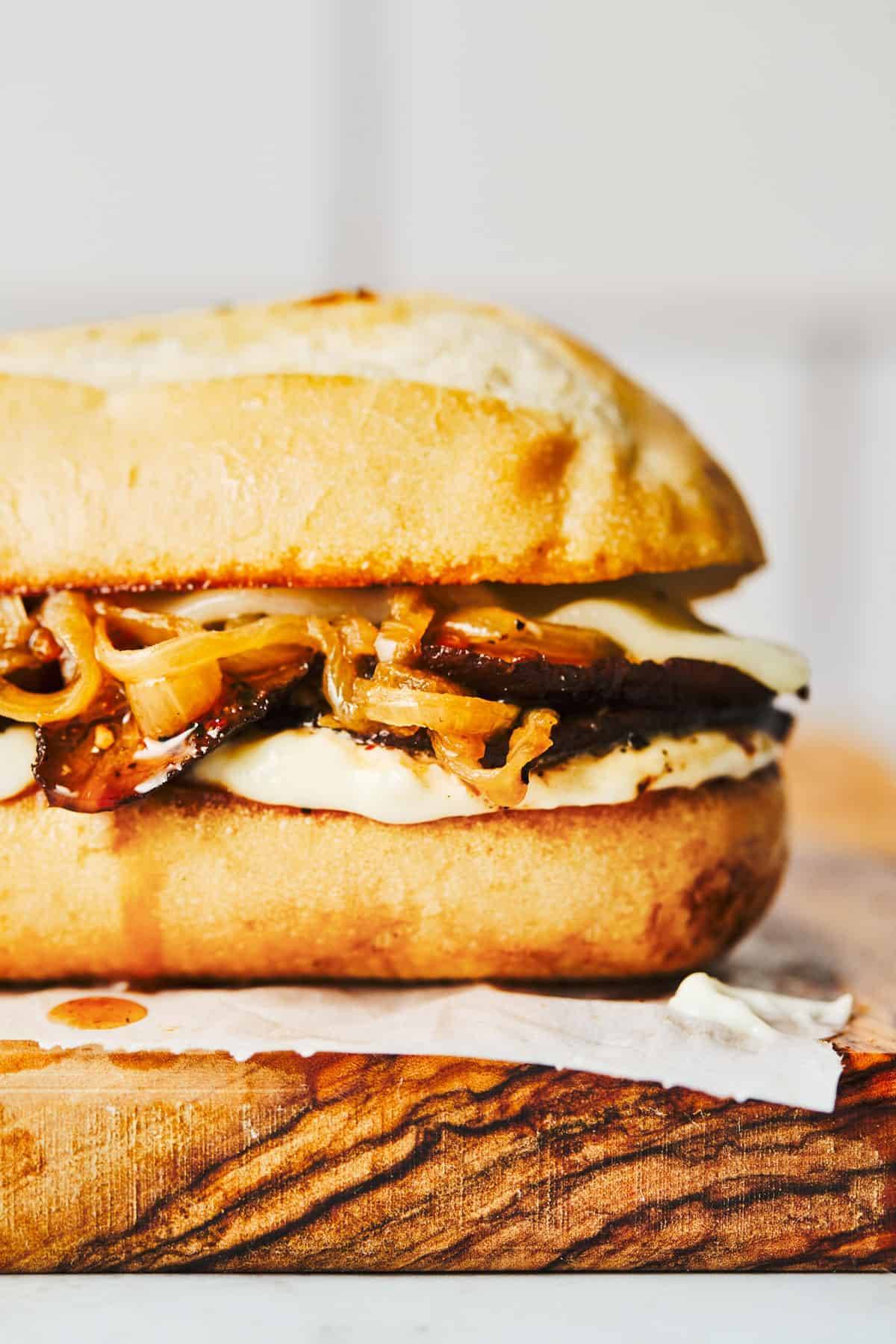 Portobello french dip on a roll with caramelized onions.