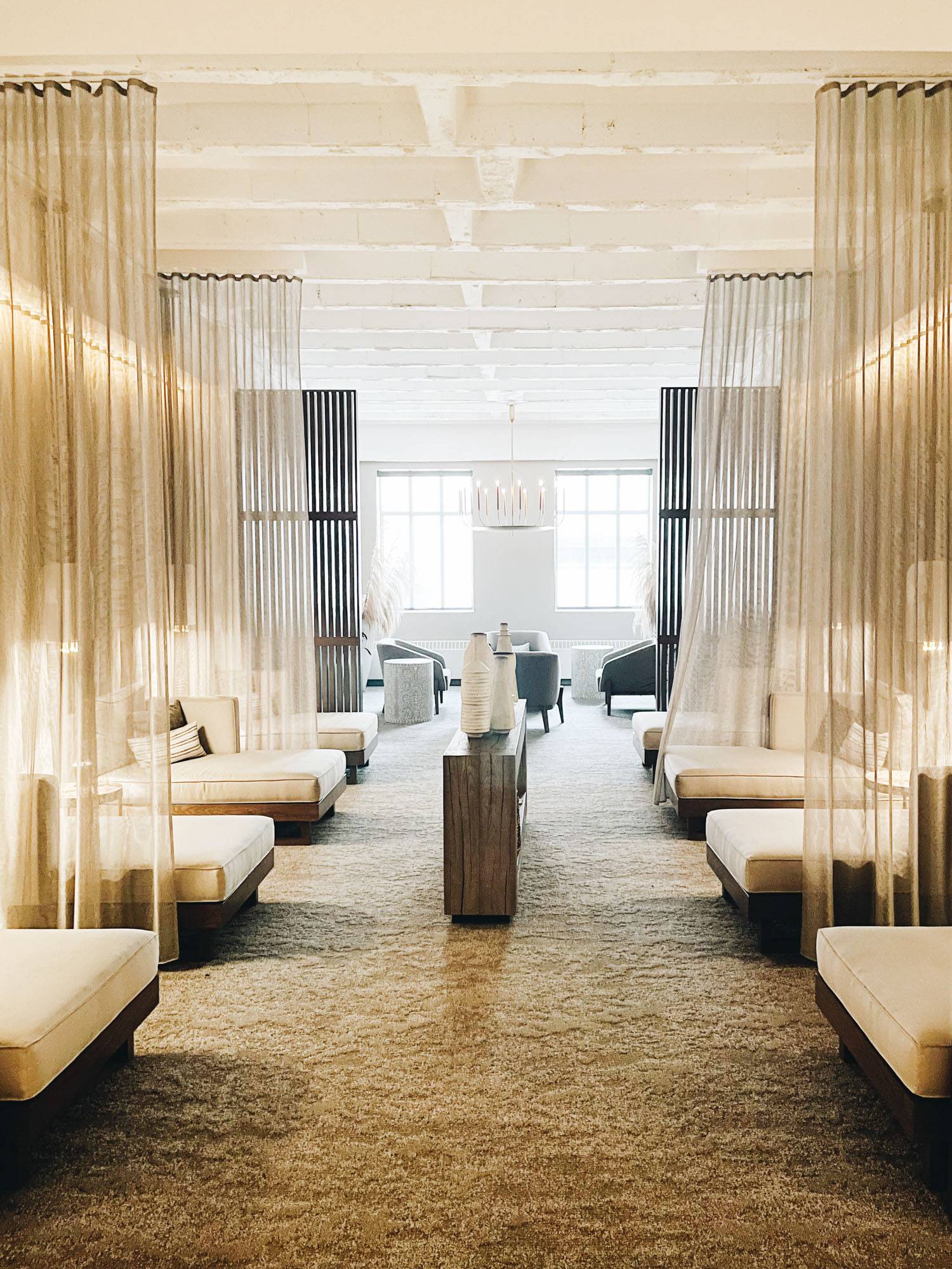 Image of the Anda Spa in downtown Minneapolis with rows of private lounge chairs.