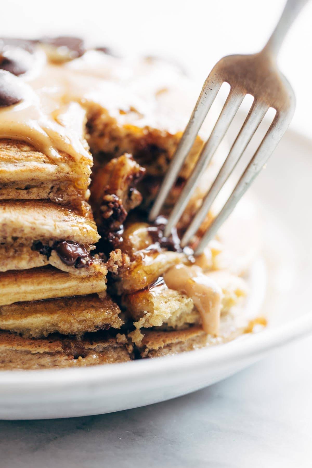 fork in pancakes on a plate