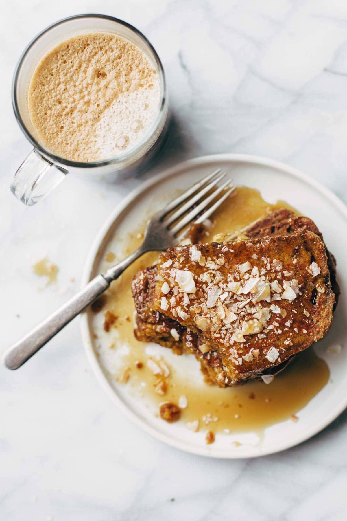 Pumpkin Bread French Toast - easy recipe with eggs, milk, vanilla, and a few pieces of pumpkin bread. Golden brown, sticky sweet brunch perfection. | pinchofyum.com