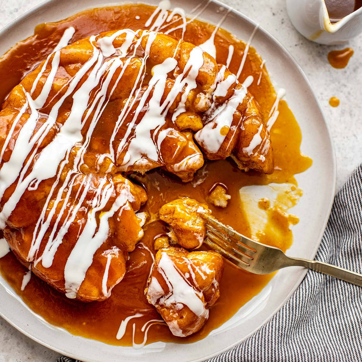 Pumpkin caramel monkey bread on a plate.