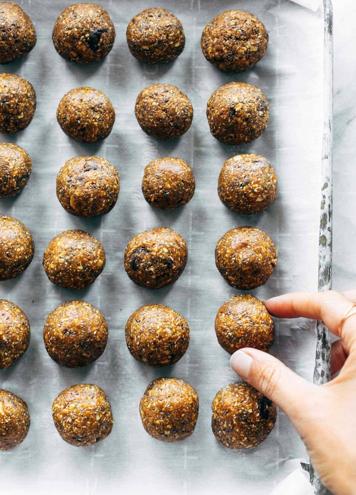 Pumpkin Energy Bites arranged on a baking sheet.