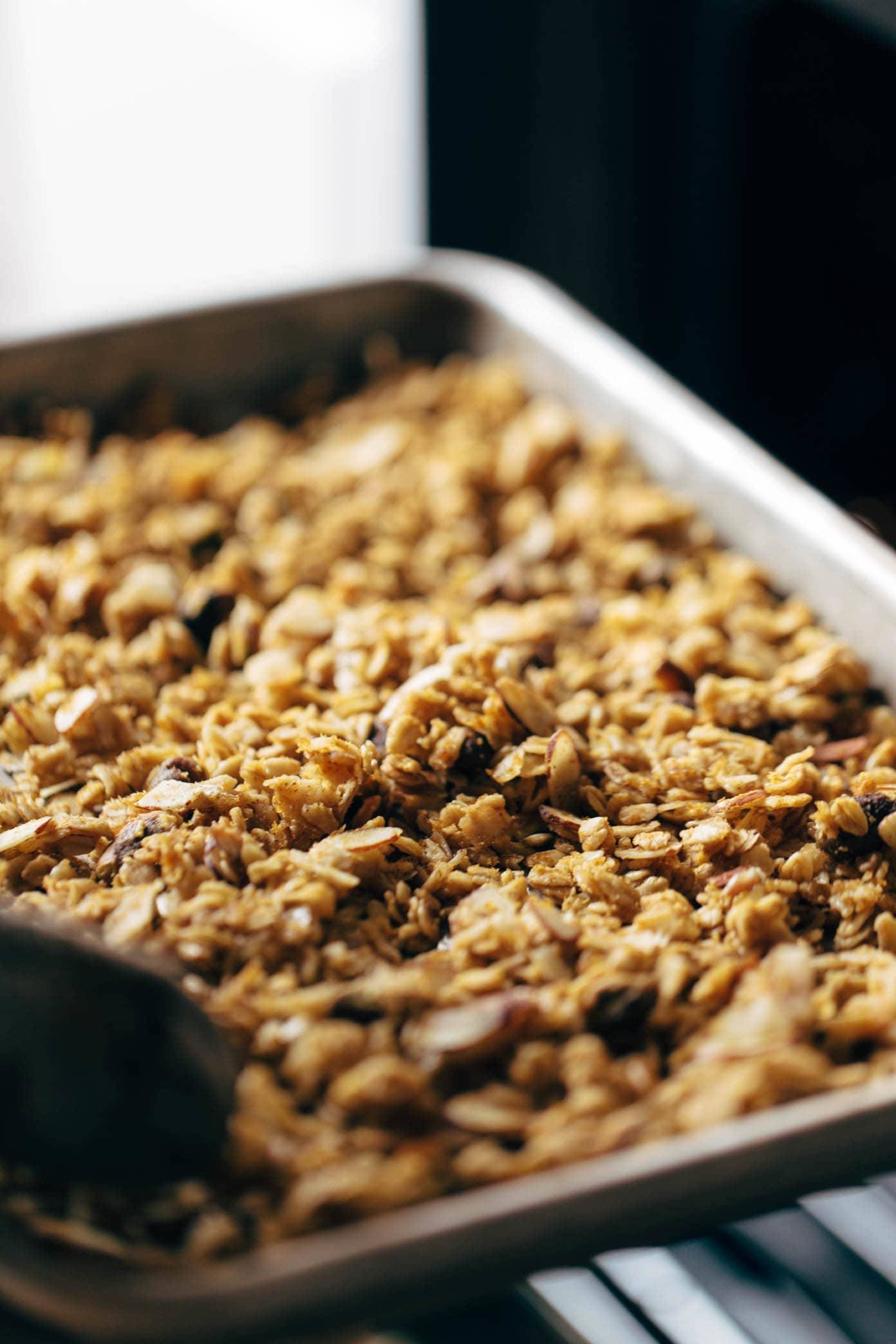 A pan of pumpkin granola on a table.