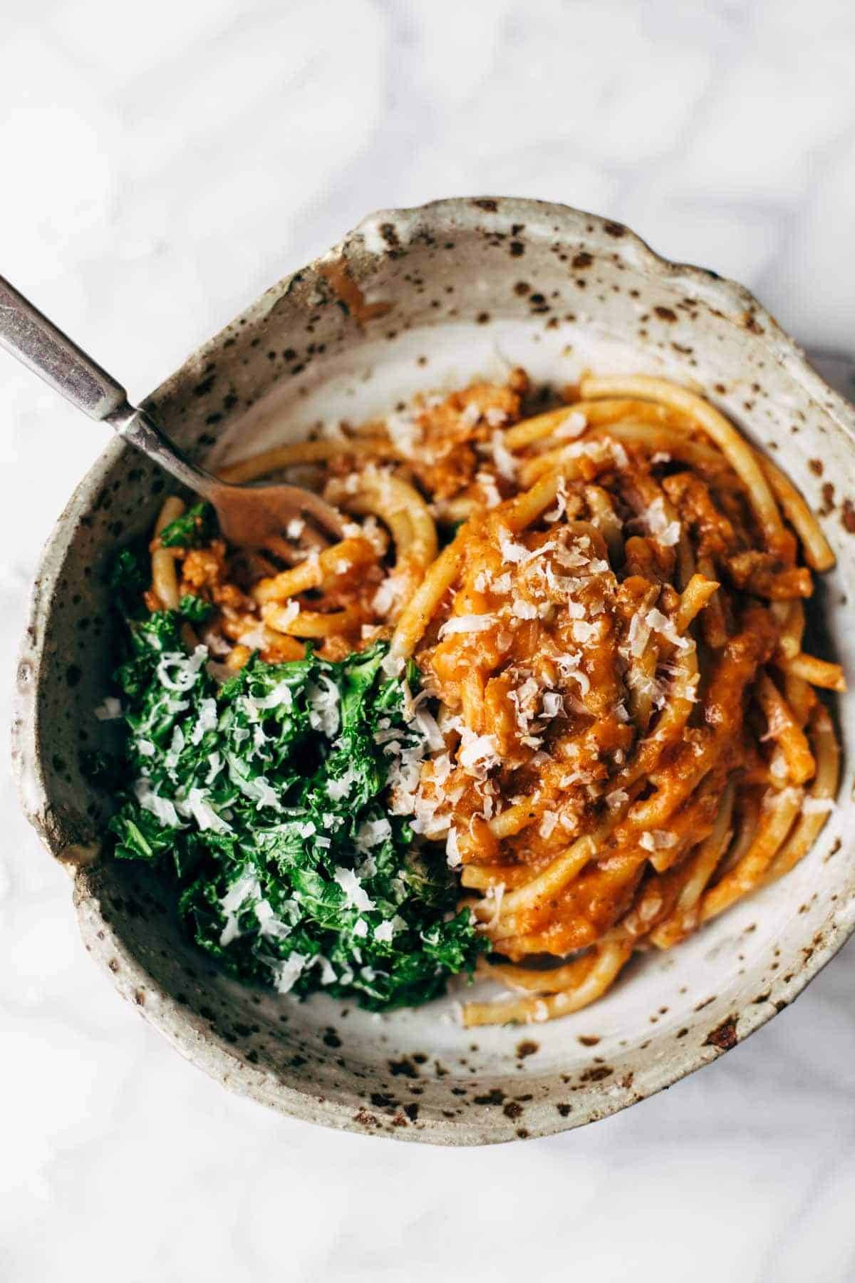 Creamy Pumpkin Spaghetti with Garlic Kale - this is the most crazy good combination! Spicy turkey, creamy pumpkin sauce, and pasta! | pinchofyum.com