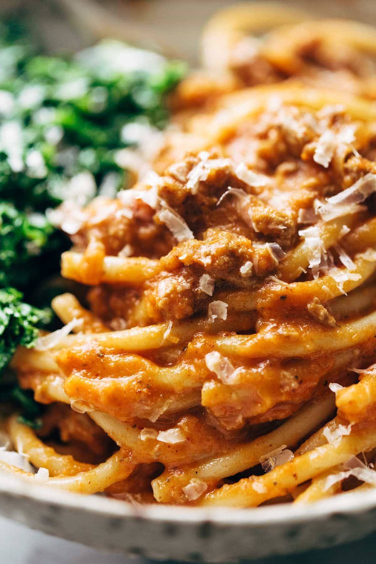 Creamy Pumpkin Spaghetti with Garlic Kale - this is the most crazy good combination! Spicy turkey, creamy pumpkin sauce, and pasta! | pinchofyum.com