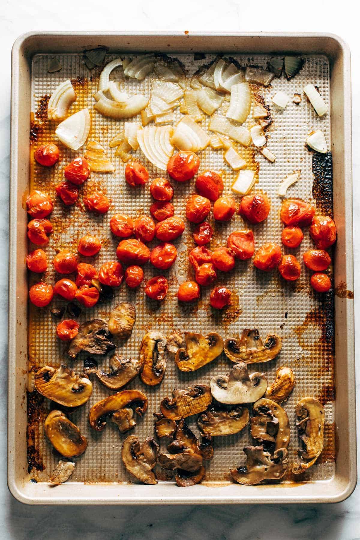 Ingredients for puttanesca on a sheet pan.