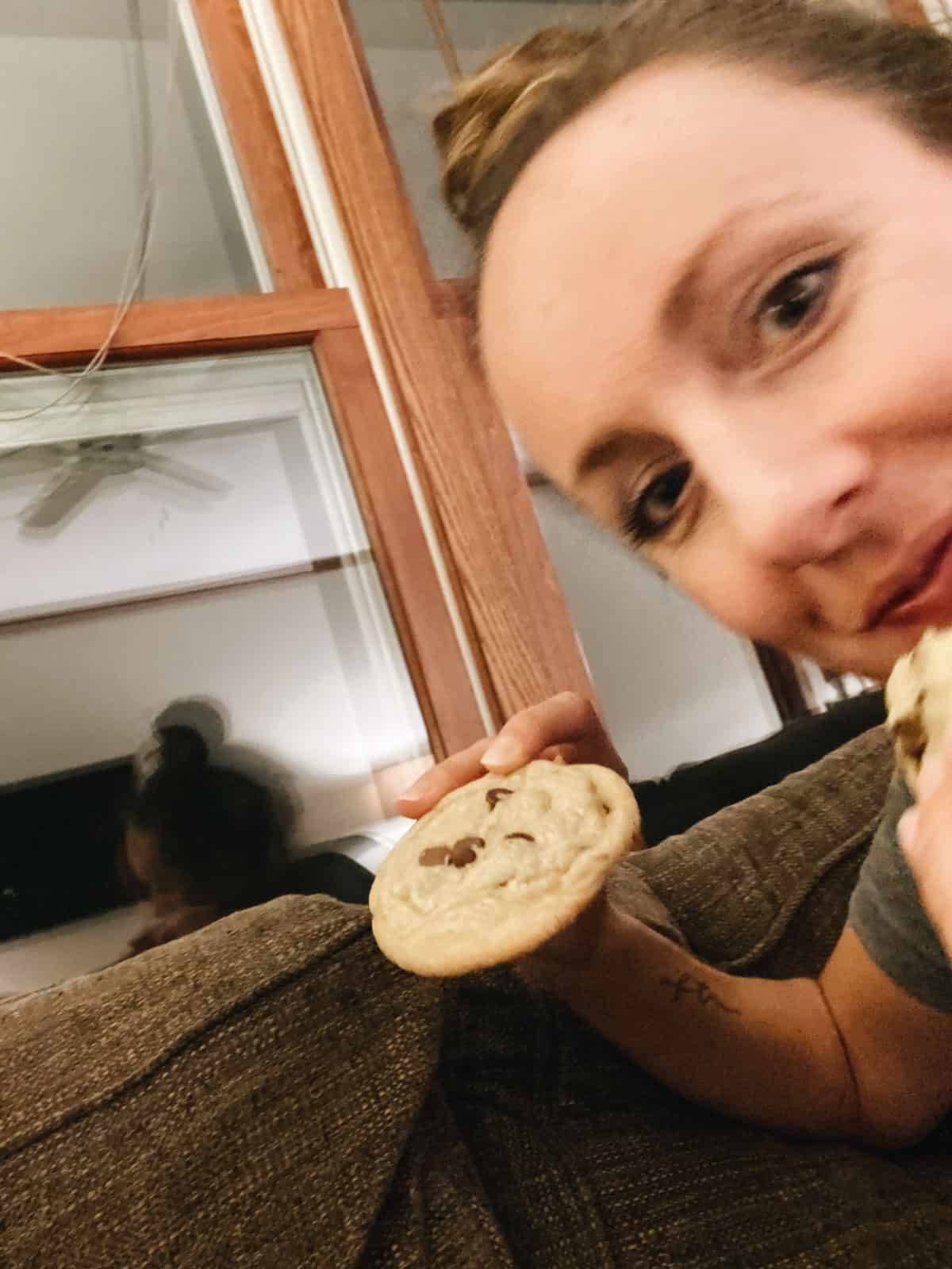 Lindsay holding a chocolate chip cookie.
