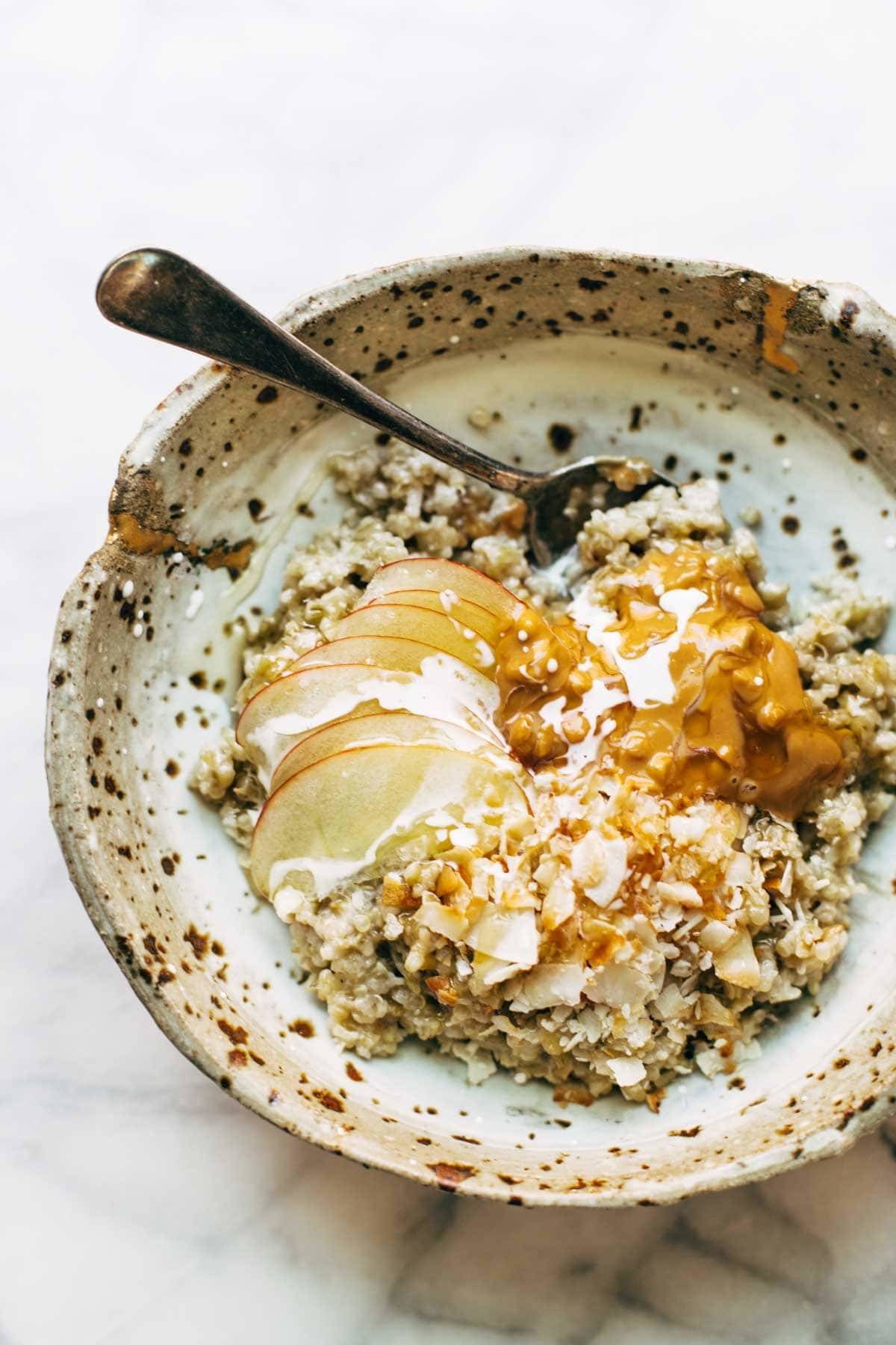 Simple Coconut Breakfast Porridge - a wholesome and cozy breakfast recipe with quinoa, oats, coconut milk, and one surprise ingredient! | pinchofyum.com
