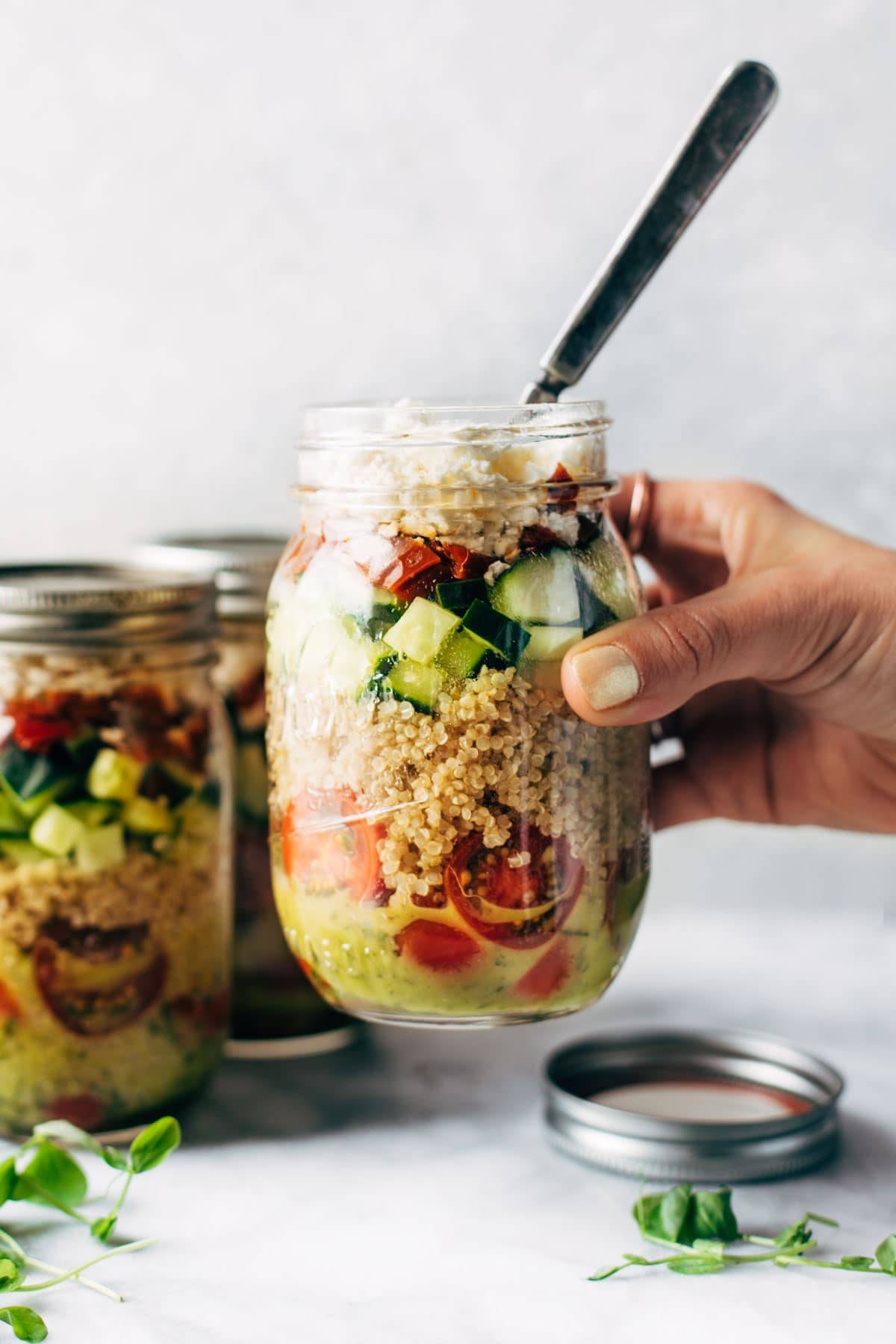 Summer Quinoa Salad in a jar with a fork.