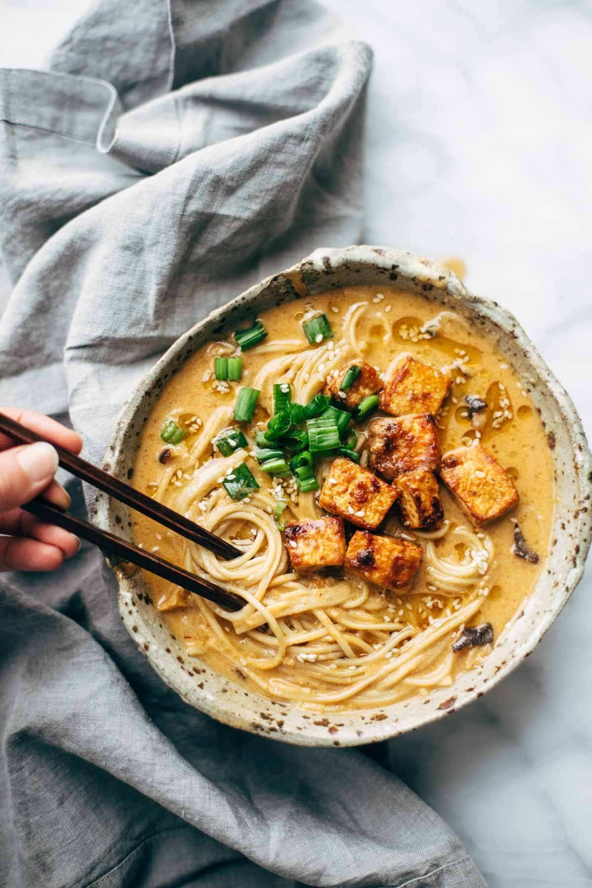 Homemade Spicy Ramen recipe with an easy spicy miso paste for the broth and dry ramen noodles that taste JUST like fresh! Vegetarian / vegan. | pinchofyum.com