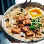 Homemade Spicy Ramen in a bowl with tofu and chopsticks.