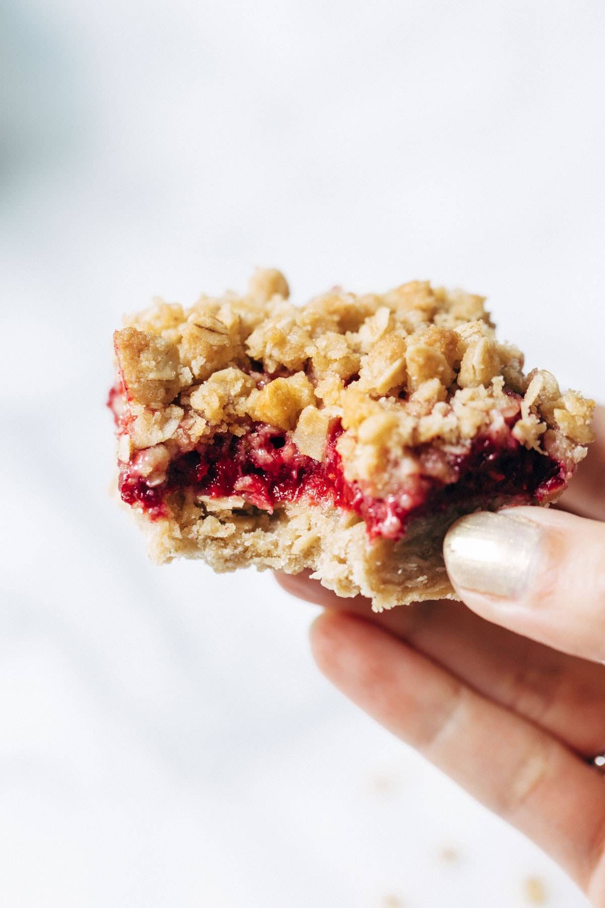 Raspberry Crumble Bar with bite taken out.