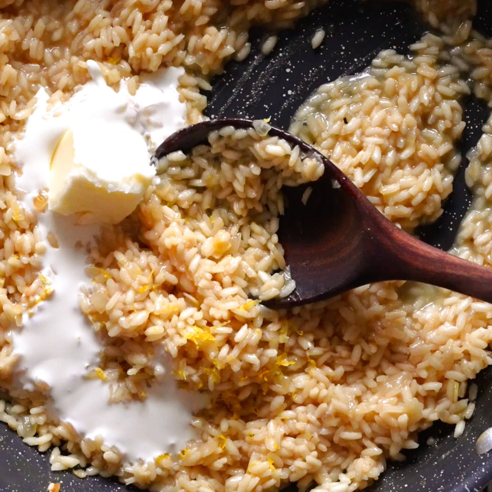 Sautéing arborio rice with butter and cream.