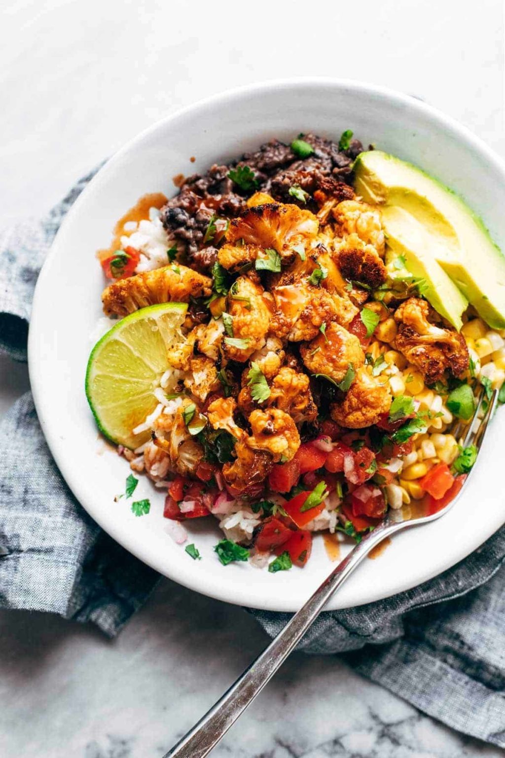 Roasted Cauliflower Burrito Bowls Recipe Pinch of Yum