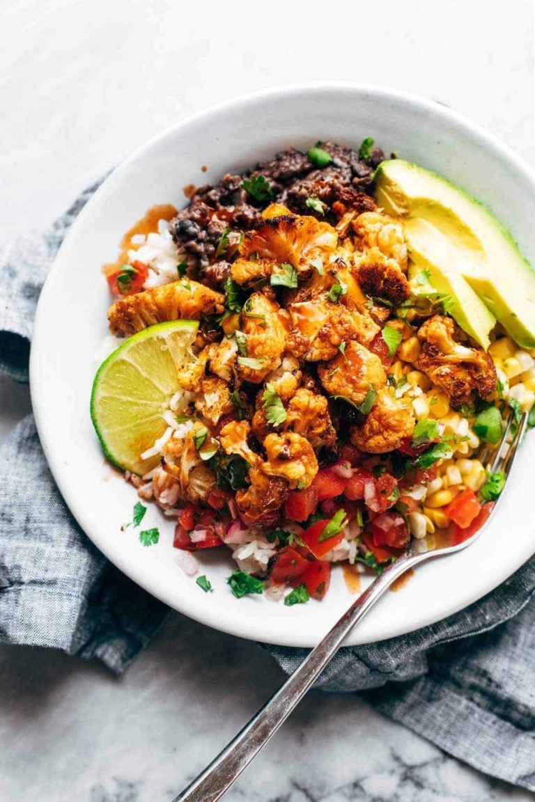 Roasted Cauliflower Burrito Bowl with toppings.