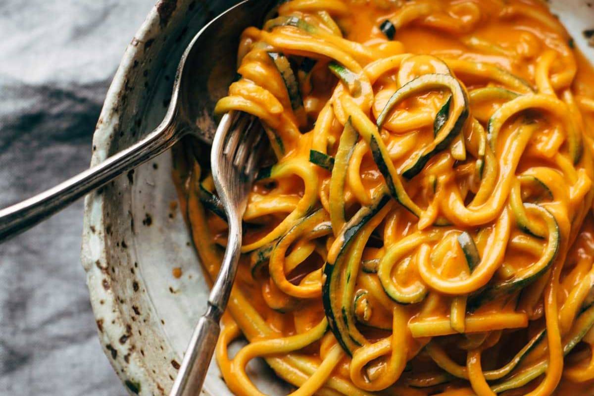 Roasted Red Pepper Pasta with two forks.