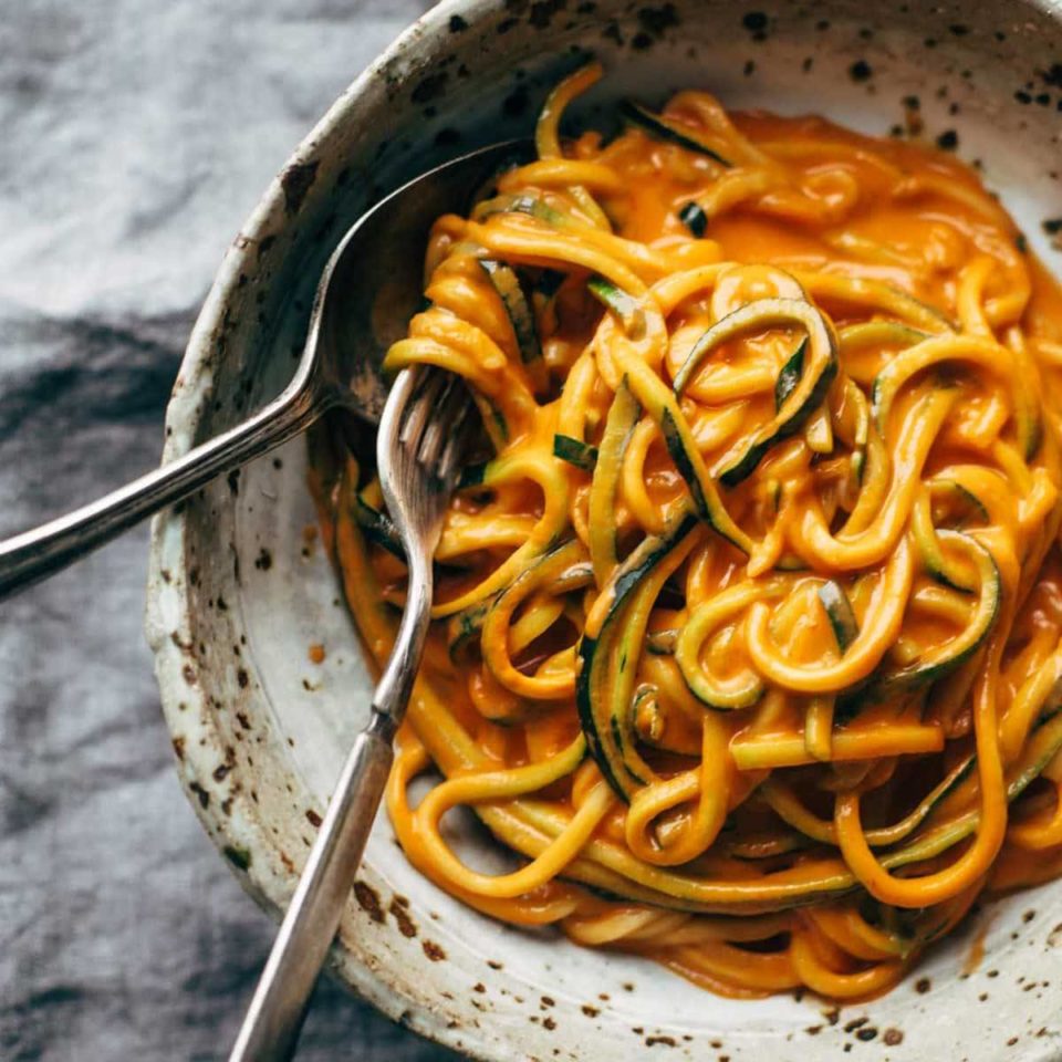 Roasted Red Pepper Pasta in a bowl with a fork.
