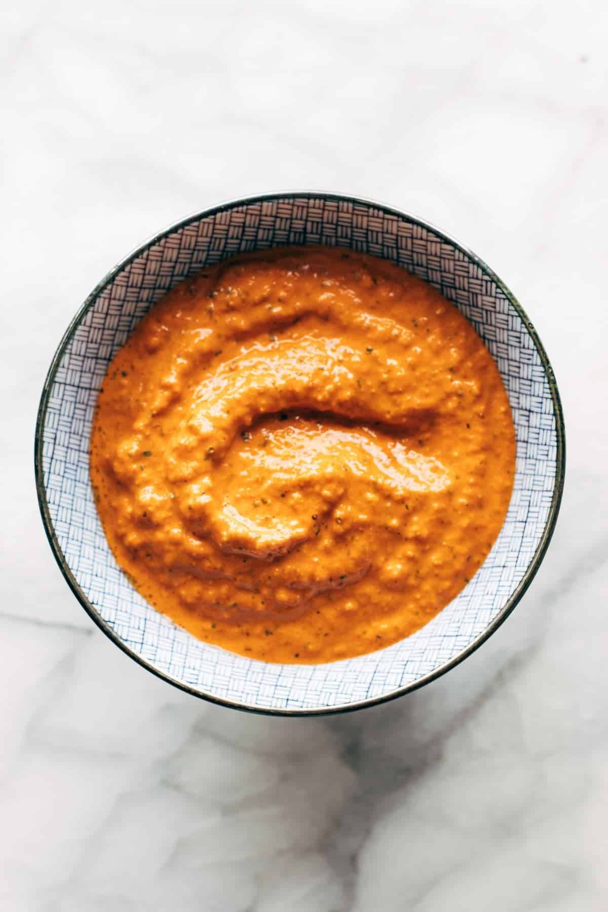Red pepper sauce in a bowl.