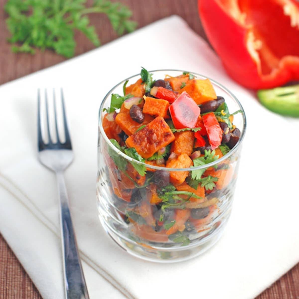 Roasted Sweet Potato Salad in a glass jar with a fork.