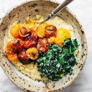 Roasted Tomatoes with Goat Cheese Polenta in a bowl with a fork.