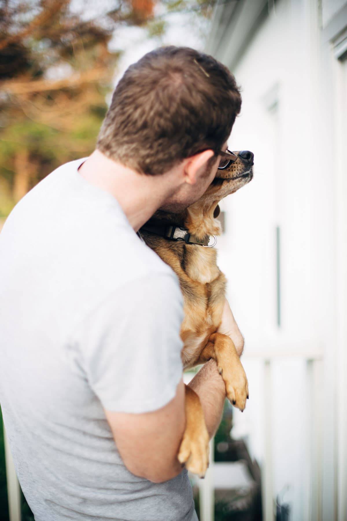 Man holding a dog.