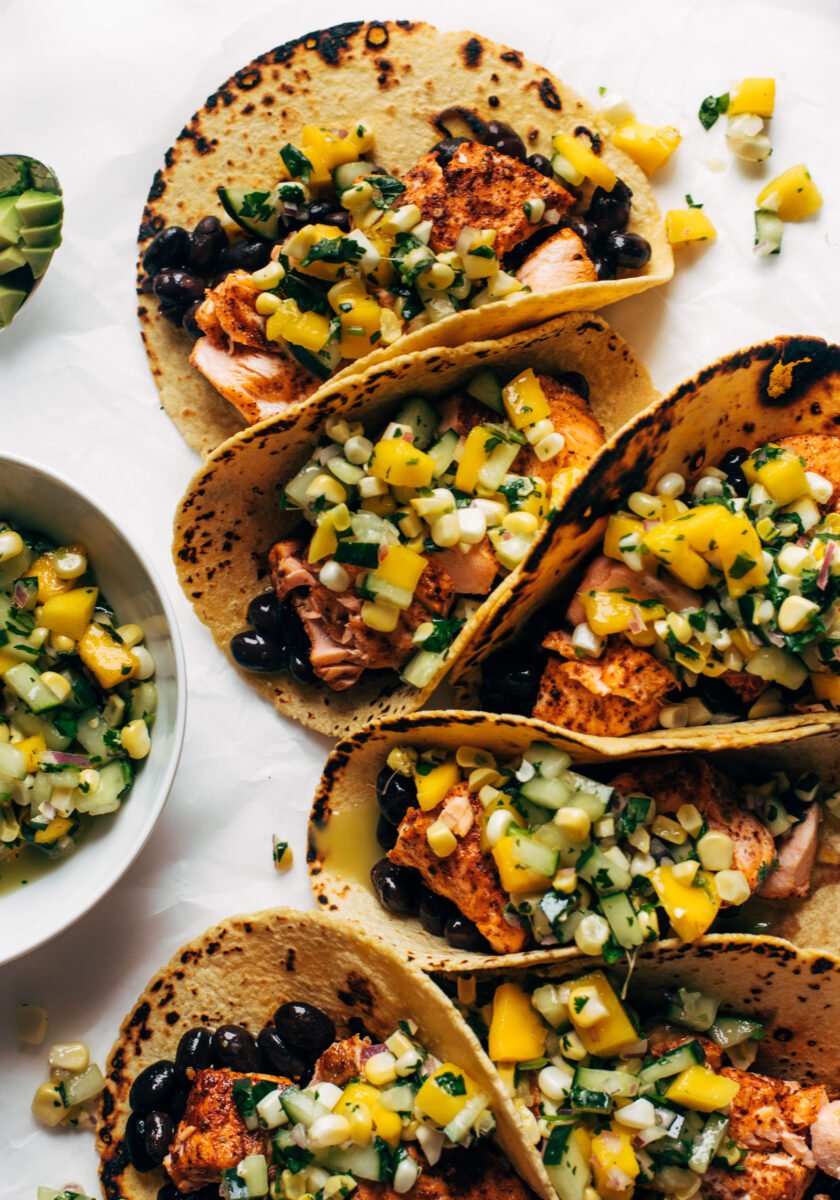 Salmon tacos with cucumber salsa lined up