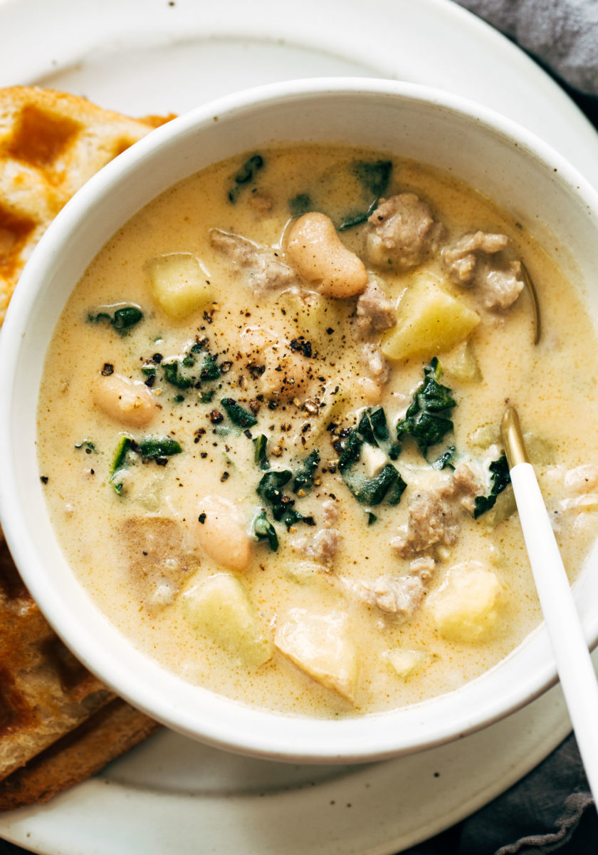 Sausage and white bean soup in a bowl.