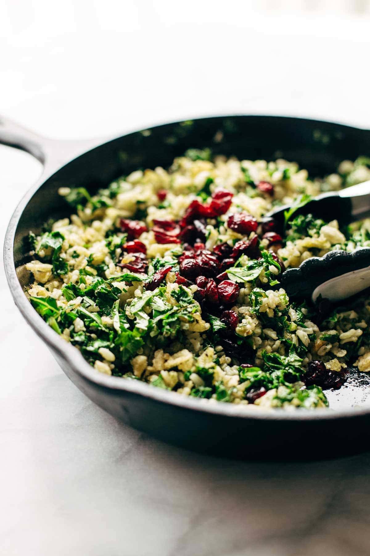 Garlic Kale and Brown Rice Salad with a zippy lemon herb dressing! This side dish recipe is so simple and it compliments almost any main dish! | pinchofyum.com